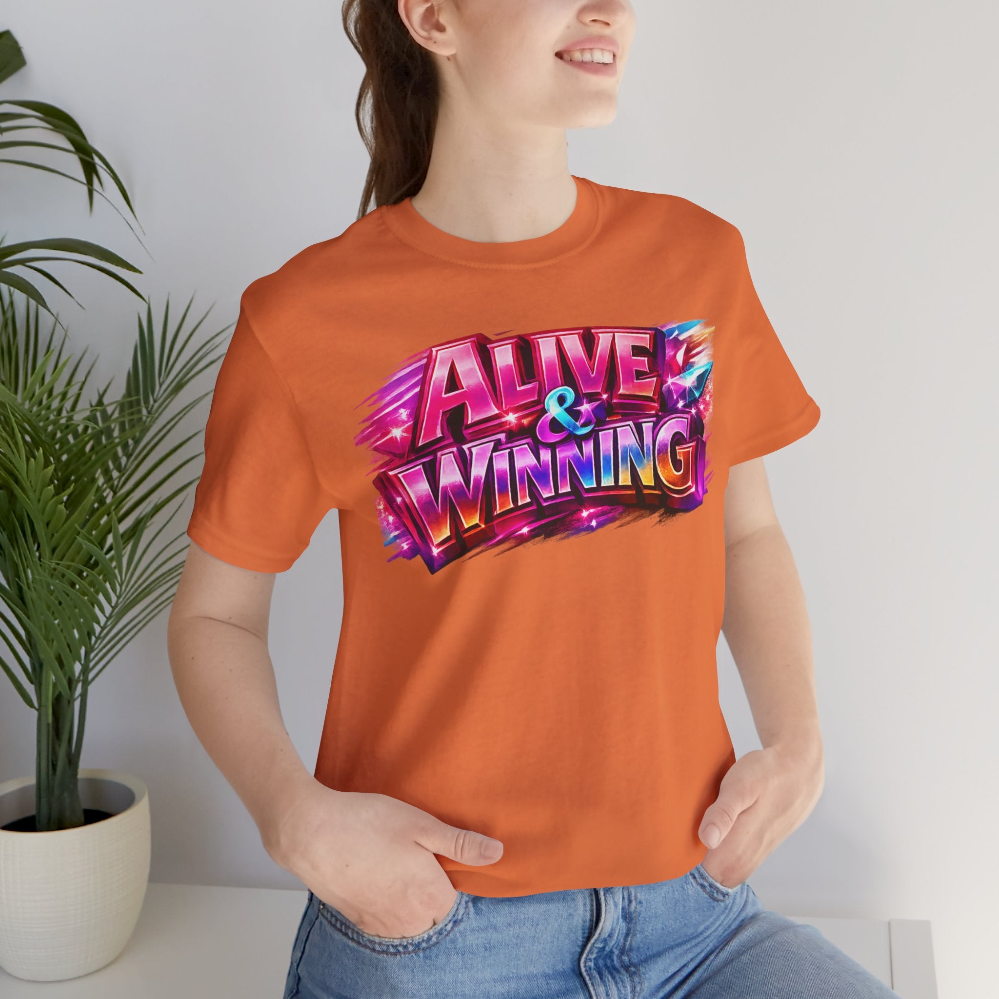 Alive & Winning Statement Graphic Tee